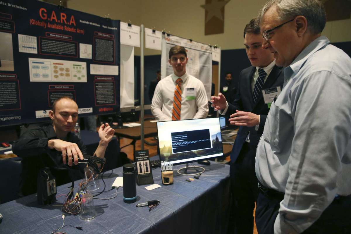 Alt-Bionics-founder-Ryan-Saavedra-demonstrates-his-bionic-hand-at-the-UTSA-Tech-Symposium-courtesy-image.jpg